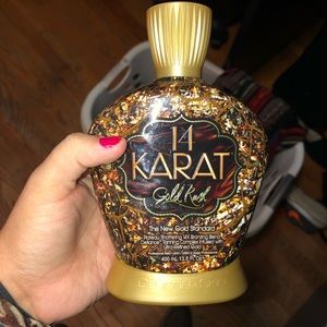 Tanning lotion. 14 kart gold.
